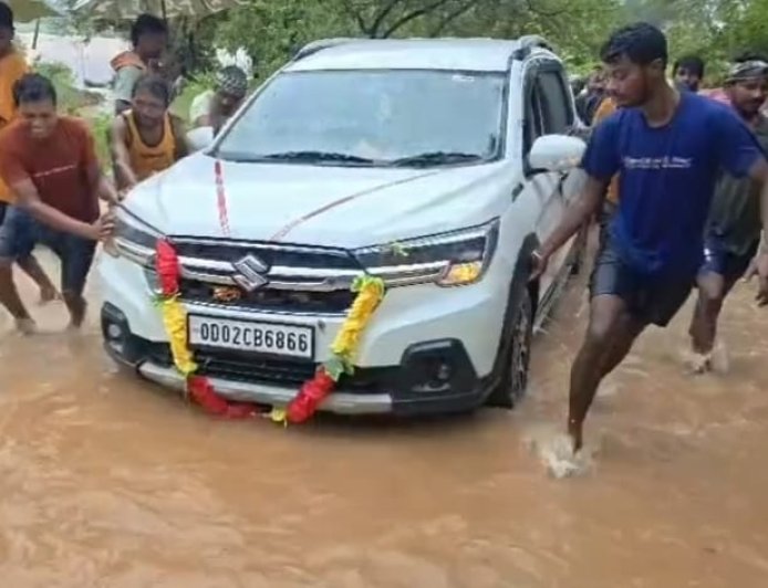 Car Swept Away in Floodwater in Udala