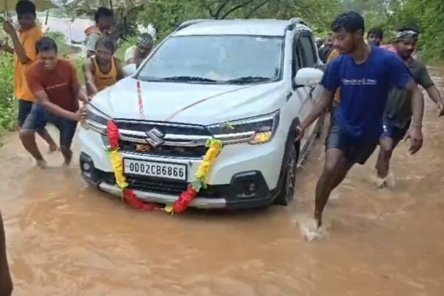 Car Swept Away in Floodwater in Udala